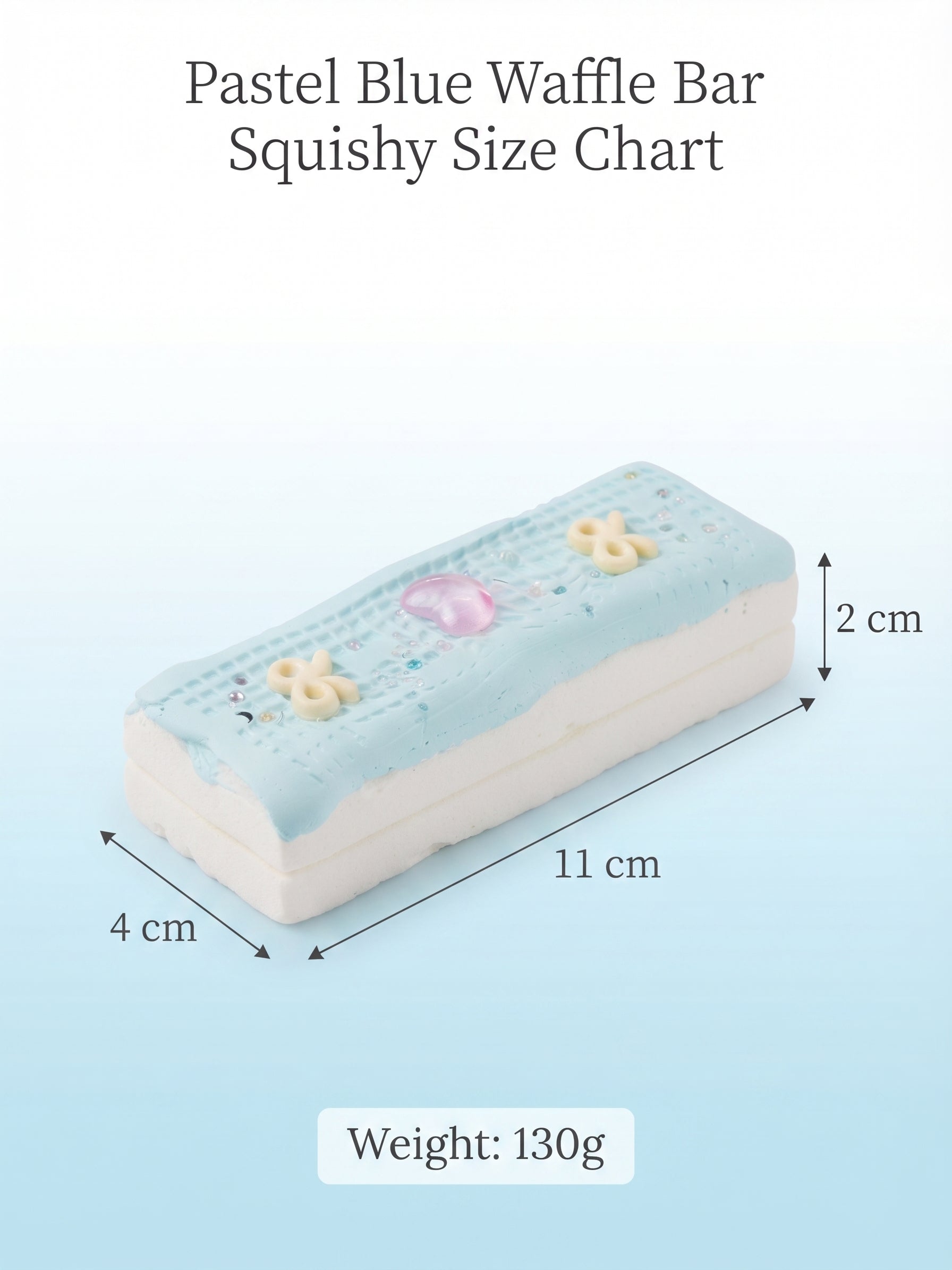 A pastel blue and white waffle bar shaped squishy with small decorative details, shown with dimension arrows and text reading 'Pastel Blue Waffle Bar Squishy Size Chart' and 'Weight: 130g'.