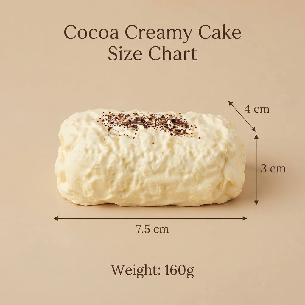 Cocoa creamy cake size chart showing a rectangular cream-colored cake with dark cocoa speckles, labeled with dimensions of 7.5 cm by 4 cm by 3 cm and a weight of 160g on a beige background.