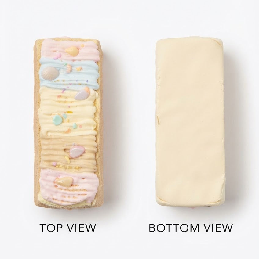A rectangular cream-colored product shown from two views on a white background: a top view on the left with pastel decorative stripes and small multicolor dots, and a bottom view on the right showing the plain back. Text labels read 'TOP VIEW' and 'BOTTOM VIEW'.