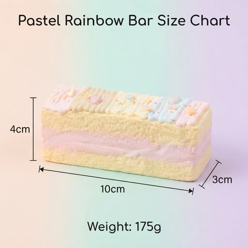 Pastel rainbow sponge cake bar with dimension measurements of 10cm by 4cm by 3cm and a weight of 175g, shown on a soft pastel gradient background.