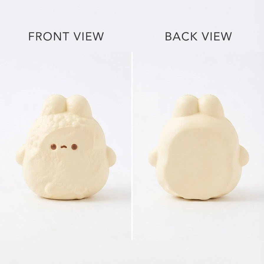 A split-view product photo showing the front and back of a small rounded cream-colored character figurine on a white background, with text labels reading FRONT VIEW and BACK VIEW.