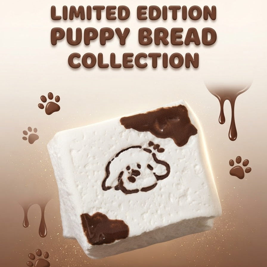 A square white bread or pastry piece with dark brown chocolate-like drizzle and a printed puppy face, floating over a brown gradient background with paw prints and the text 'LIMITED EDITION PUPPY BREAD COLLECTION'.