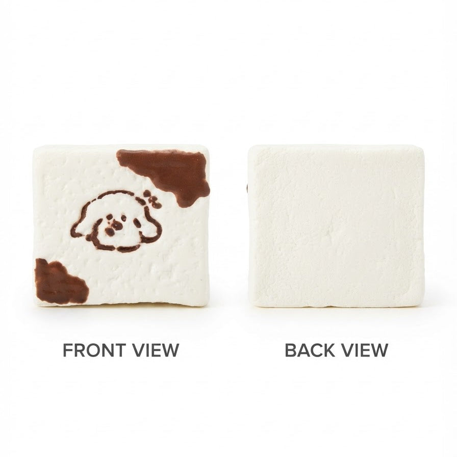 A square white textured item shown from two sides on a white background, labeled FRONT VIEW and BACK VIEW. The front side has a simple brown line drawing of a dog face with brown patches, and the back side is plain.