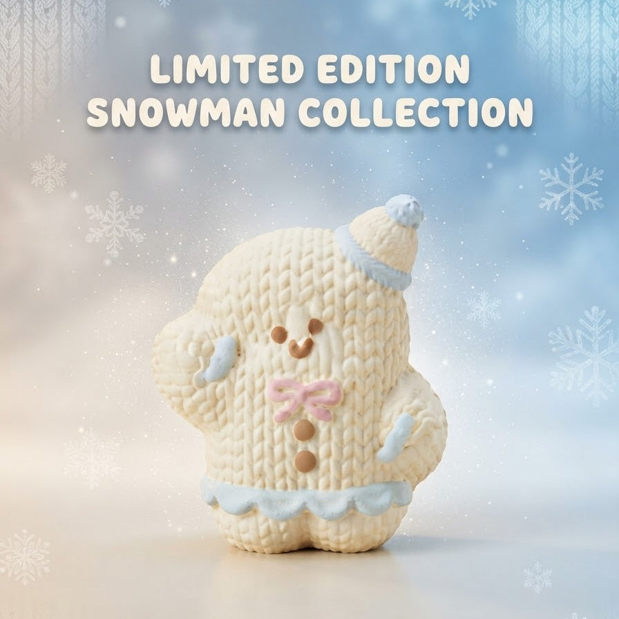 A knitted snowman figurine in cream with light blue trim and a pink bow tie, centered on a soft blue and white holiday background with the text 'LIMITED EDITION SNOWMAN COLLECTION' above it.
