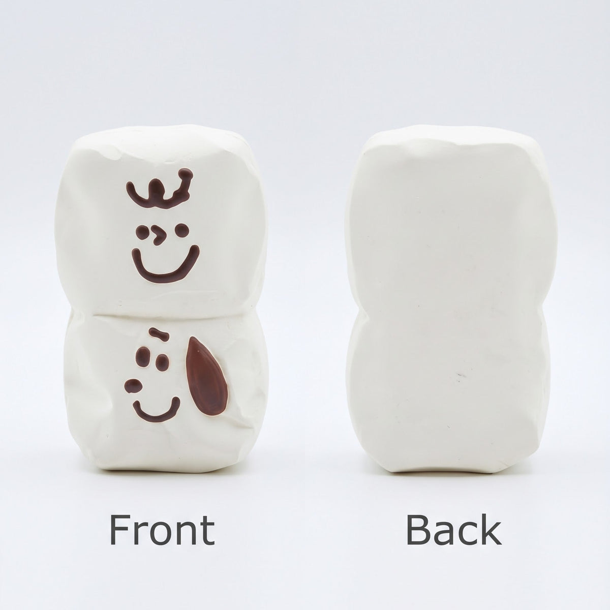 Two small white rectangular blocks shown on a light gray background, labeled Front and Back. The left block has dark brown cartoon face details on the front, and the right block is plain on the back.