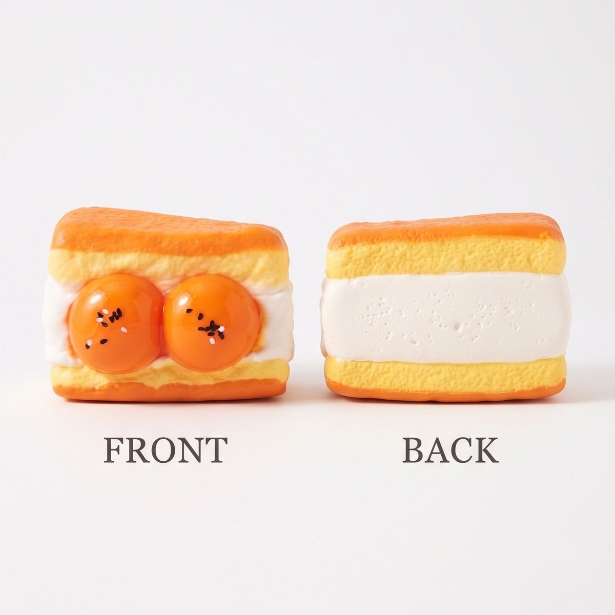 Two views of a small sandwich-style toy or novelty item on a plain white background, labeled FRONT and BACK. The item has orange-brown top and bottom layers, pale yellow sides, and a large white center, with two orange round details on the front view.