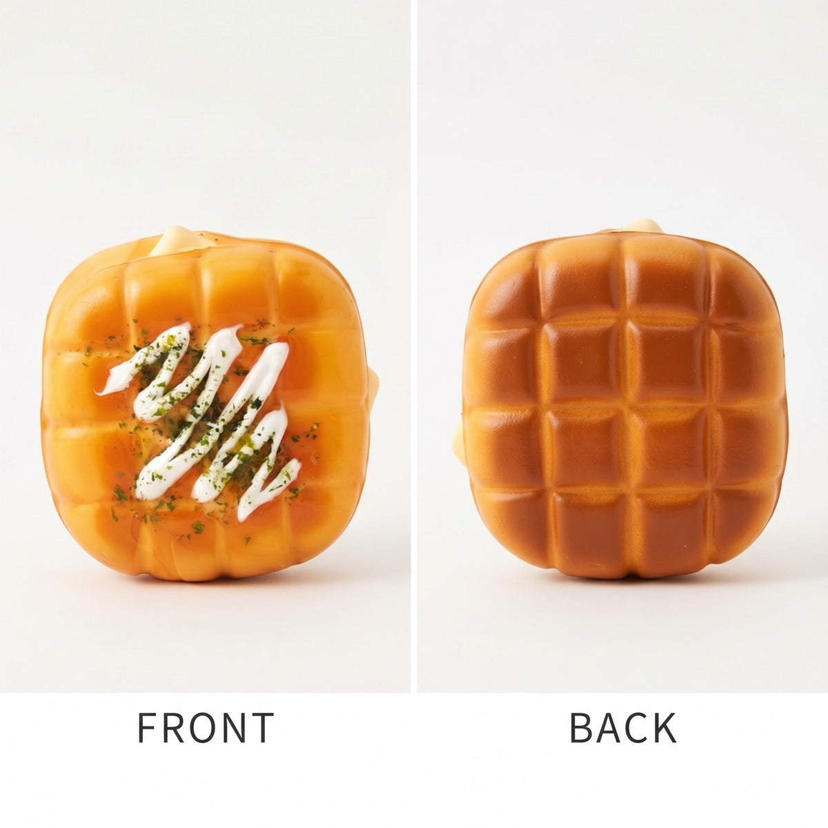 A split-screen product photo showing the front and back views of a square, pumpkin-shaped orange candle. The front view shows a white drizzle with green herb flecks, and the back view shows a grid texture.