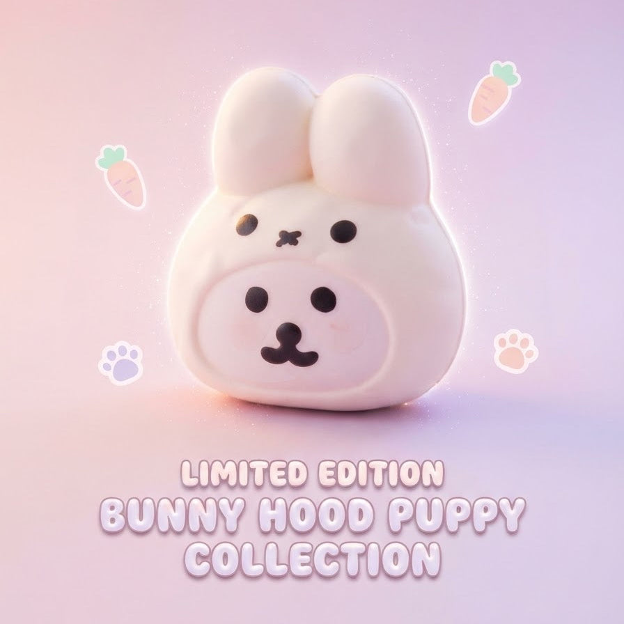 A cute white bunny hood with a puppy face, shown against a soft pink and purple gradient background with floating carrot and paw print illustrations. Text at the bottom reads 'LIMITED EDITION BUNNY HOOD PUPPY COLLECTION'.