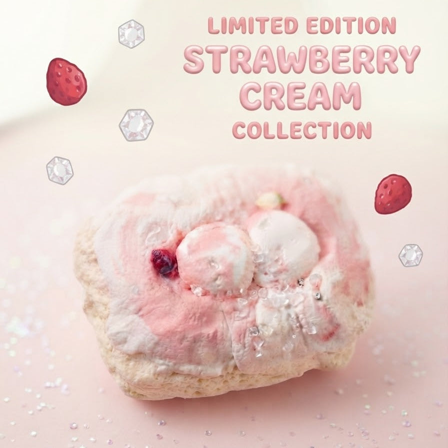 A pink strawberry cream pastry or dessert on a soft pink background with decorative text reading 'LIMITED EDITION STRAWBERRY CREAM COLLECTION' and small floating strawberry and gem illustrations.