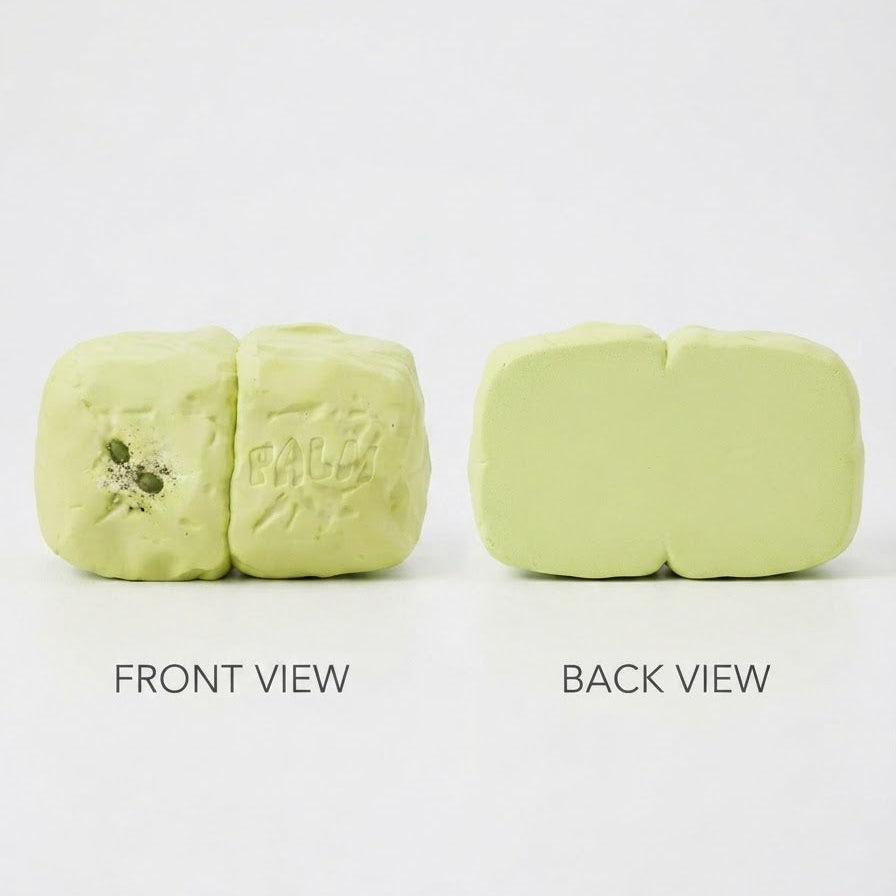 A pale yellow-green wax melt shown from both front and back views on a white background, with text labels underneath.