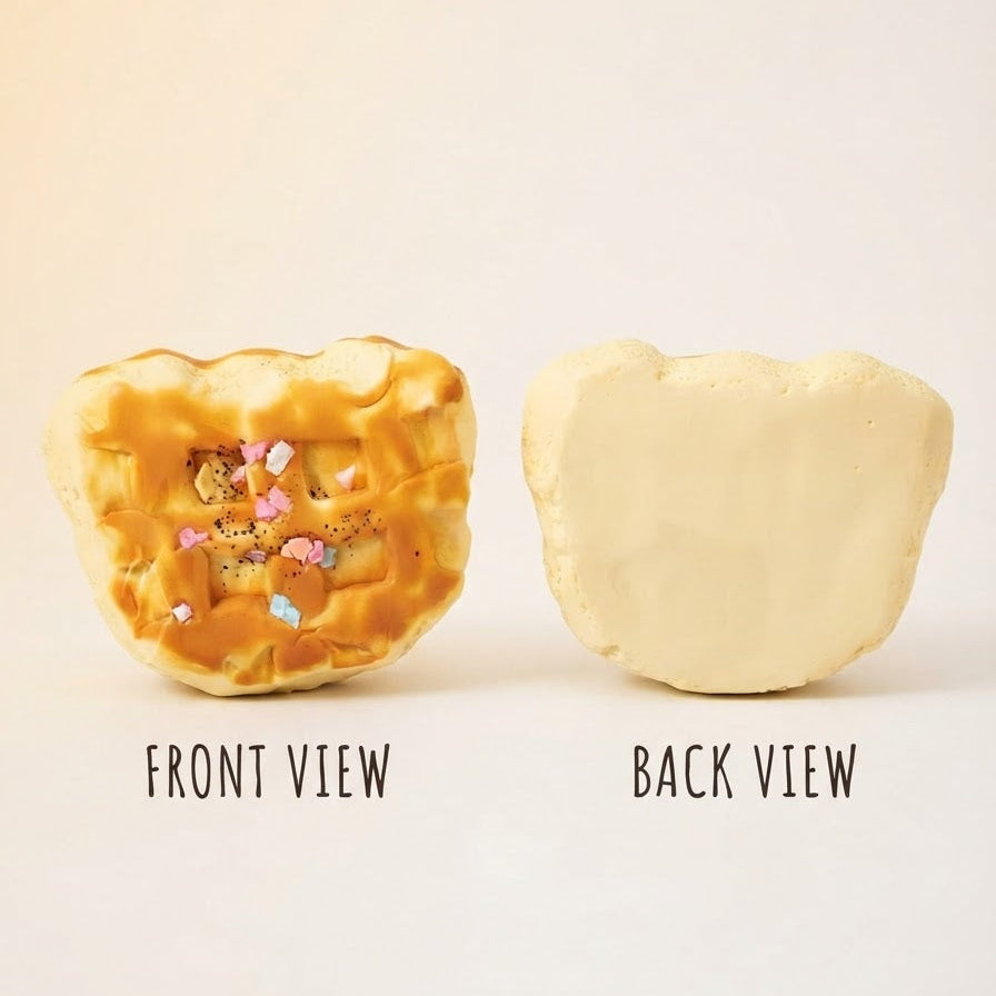 A product shown in two views on a plain light background: the front view displays a golden-brown, waffle-textured item with small pastel decorative pieces inside, and the back view shows a smooth, pale cream-colored back. Text labels 'FRONT VIEW' and 'BACK VIEW' appear below each view.
