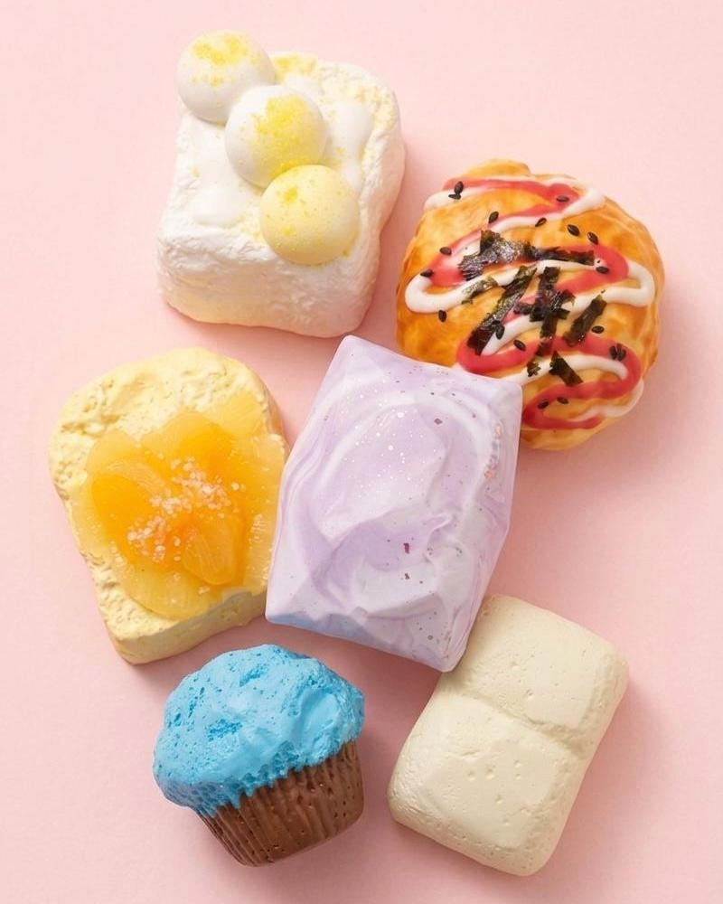Colorful bath bombs on a pink background