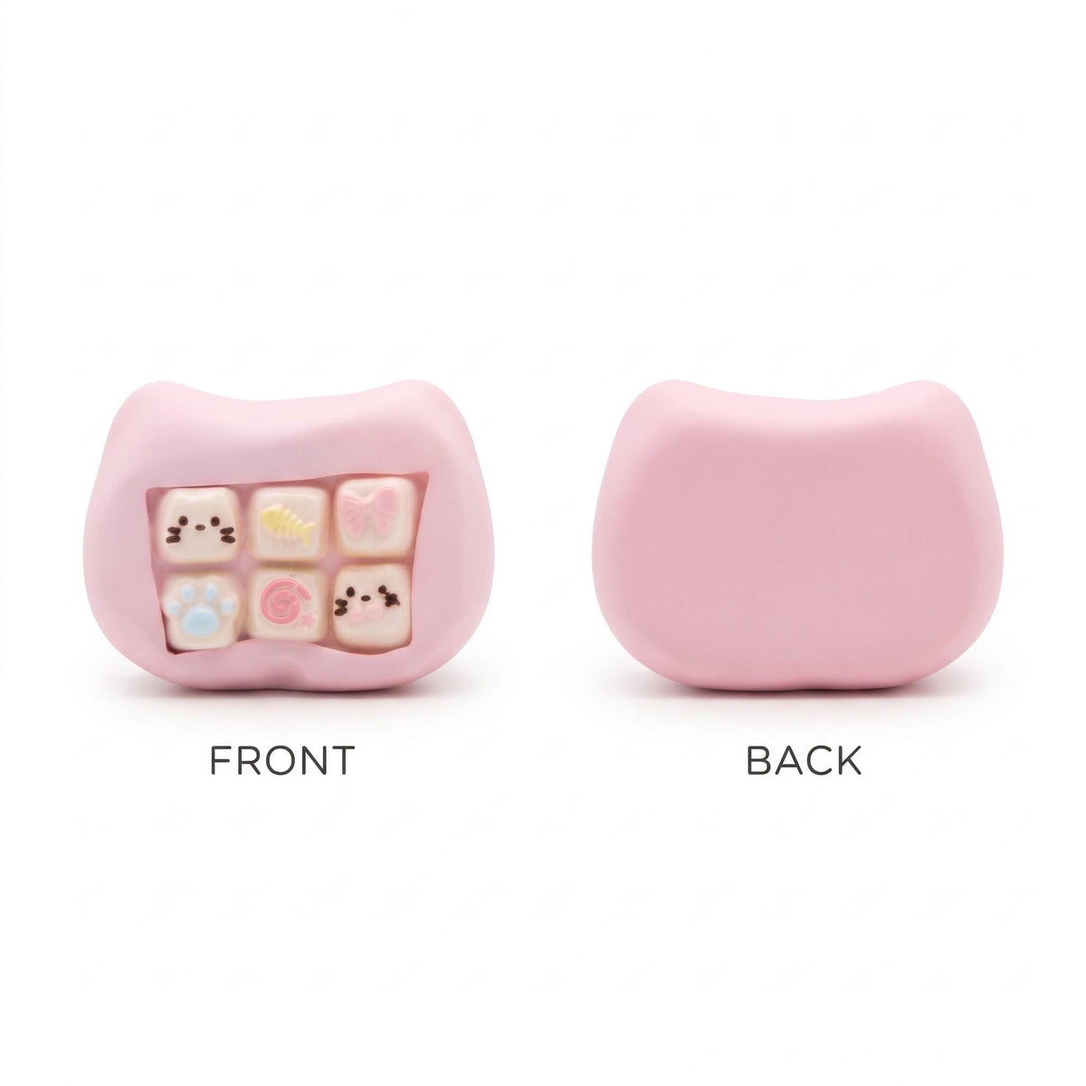 A pink silicone keyboard keycap cover shown from both front and back. The front view shows a recessed window containing six cute pastel-colored keycaps with simple cartoon faces, while the back view shows the solid pink silicone exterior.