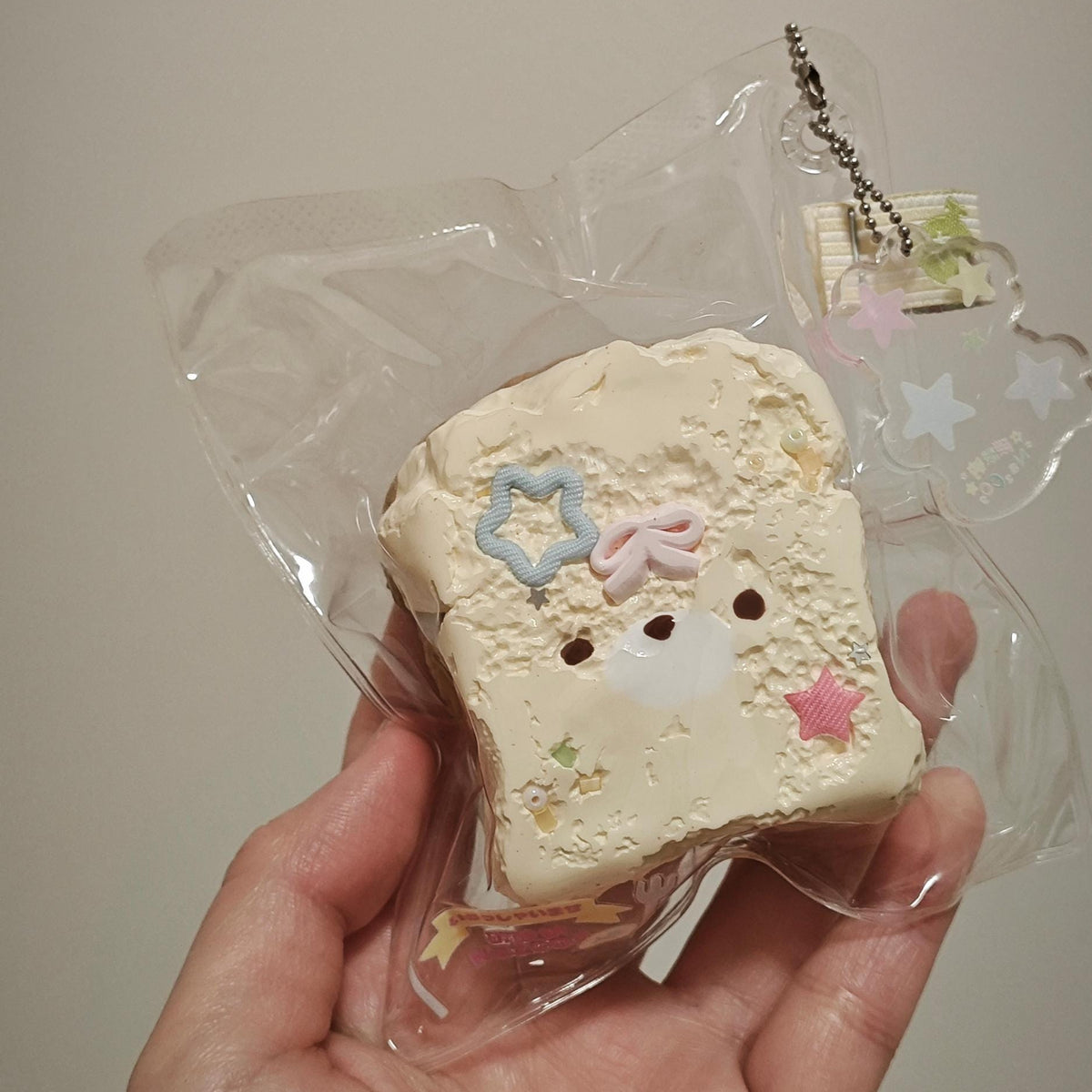Kawaii Bread Keychain Squishy Toy Stress Relief Fidget Charm Cute Pastel Star Design Silicone Squeeze Sensory Pendant Bag Accessory Backpack Zipper Attachment Perfect Gift Japanese Style Collectible Miniature Food Charm Soft Squeeze Toy